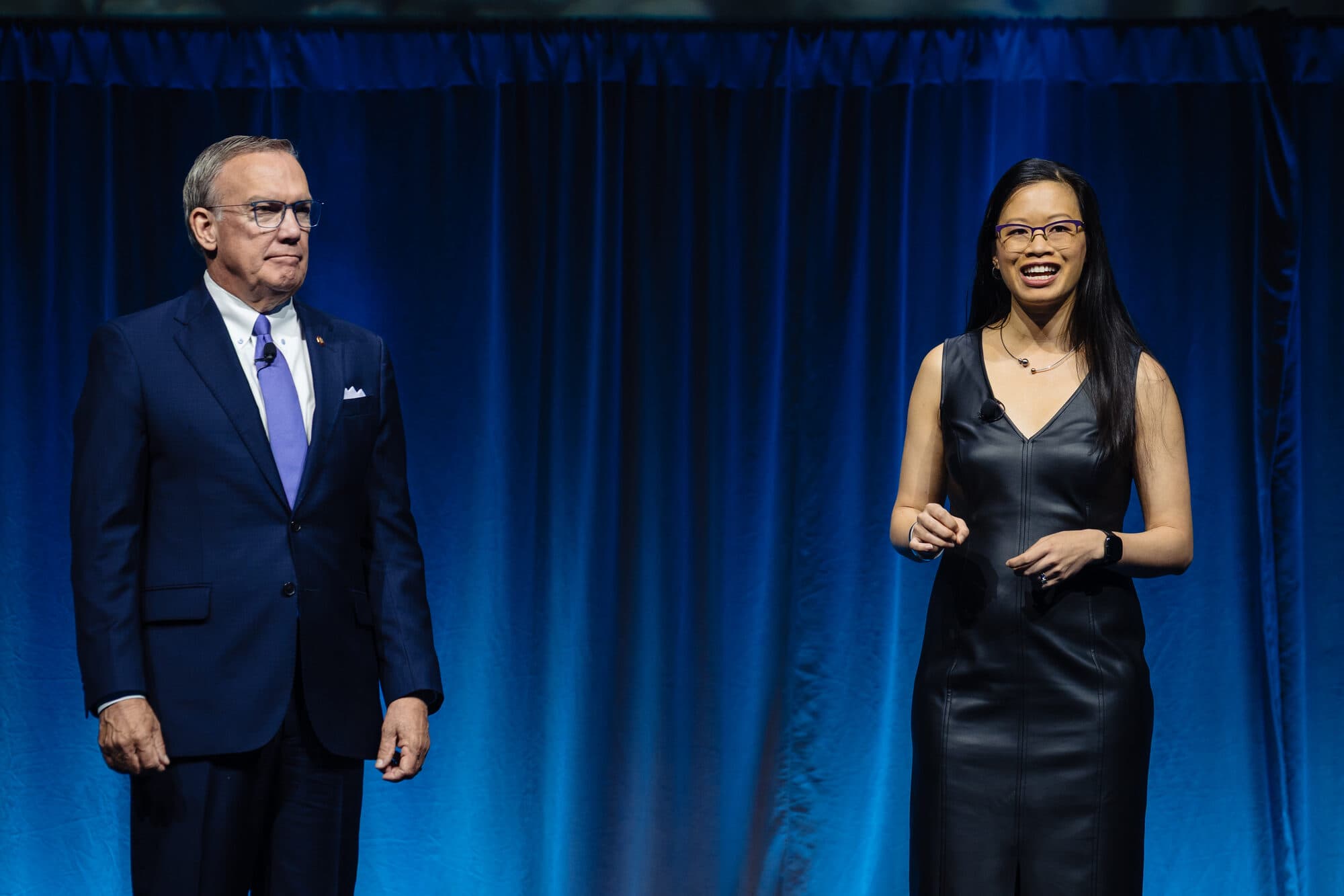 Evelyn Lee on stage with a guest at the AIA25 Conference, June 2025.