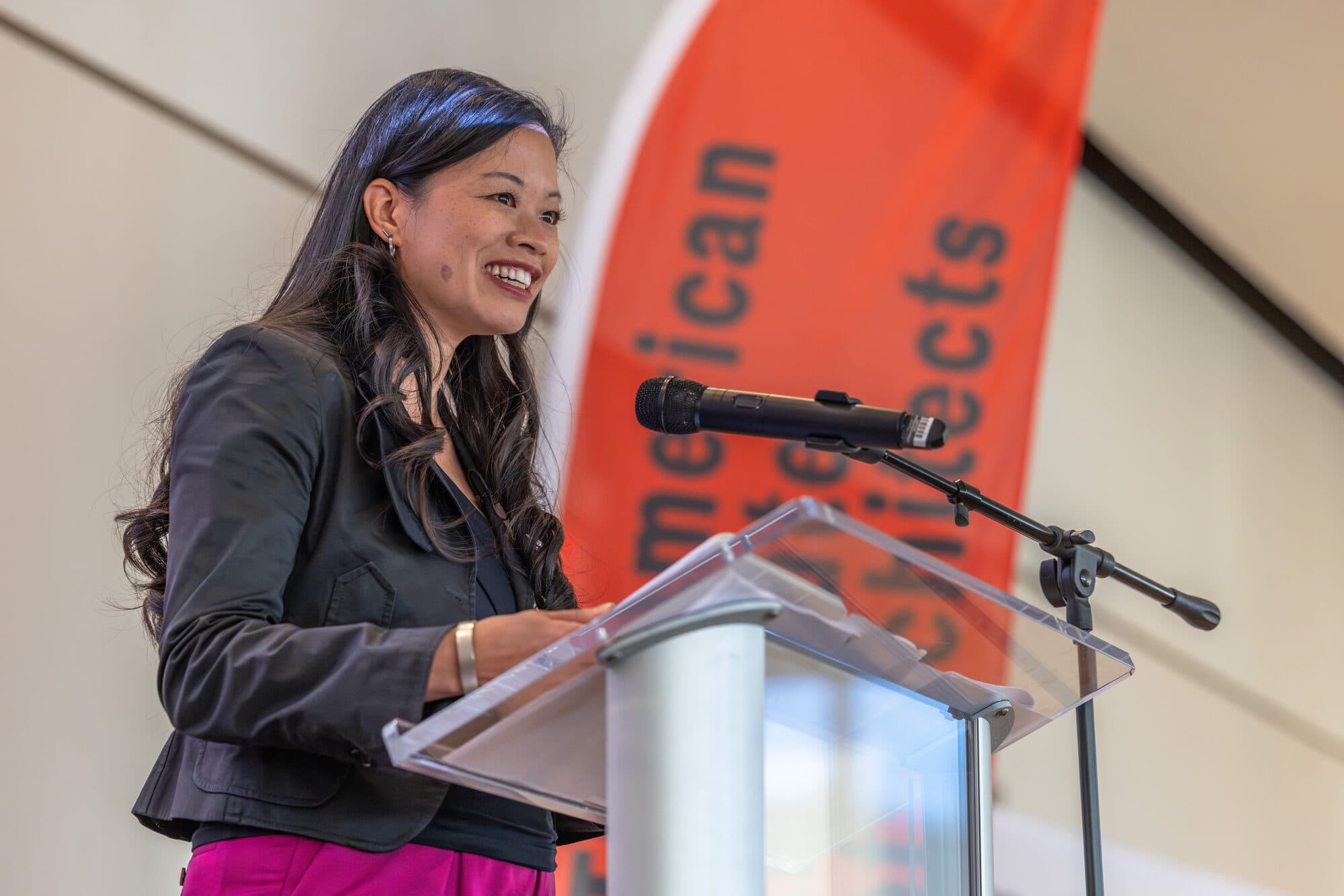Evelyn Lee at the podium, AIA Charlotte Women in Architecture Rise & Design breakfast, October 2025.